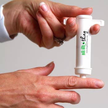 The suction tool up against a model's finger