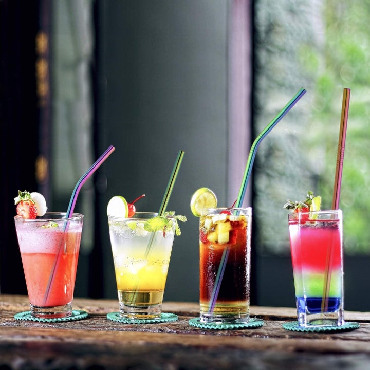 rainbow-tone reusable straws in different cocktail glasses