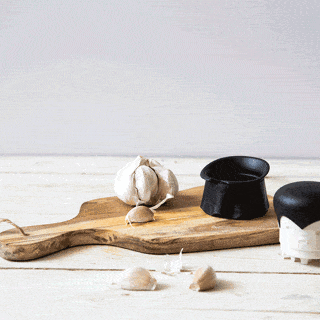 Model using garlic crusher in gif