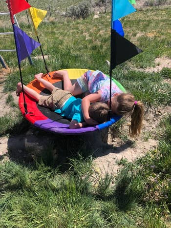 Reviewer's two kids on the swing