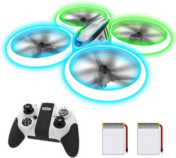 The lit up drone with a remote control and two batteries