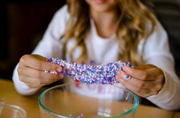 reviewer playing with blue and purple slime