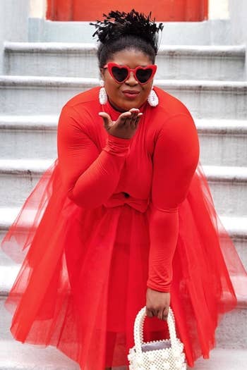 reviewer in the red heart shaped sunnies