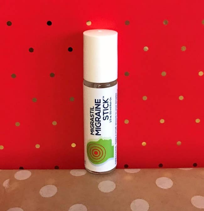 the migraine stick against a red background