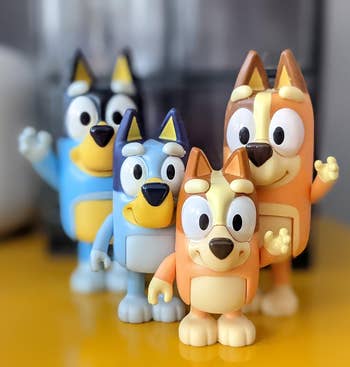 the four bluey figures