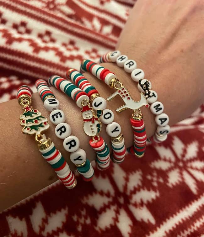 reviewer wearing the christmas bracelets