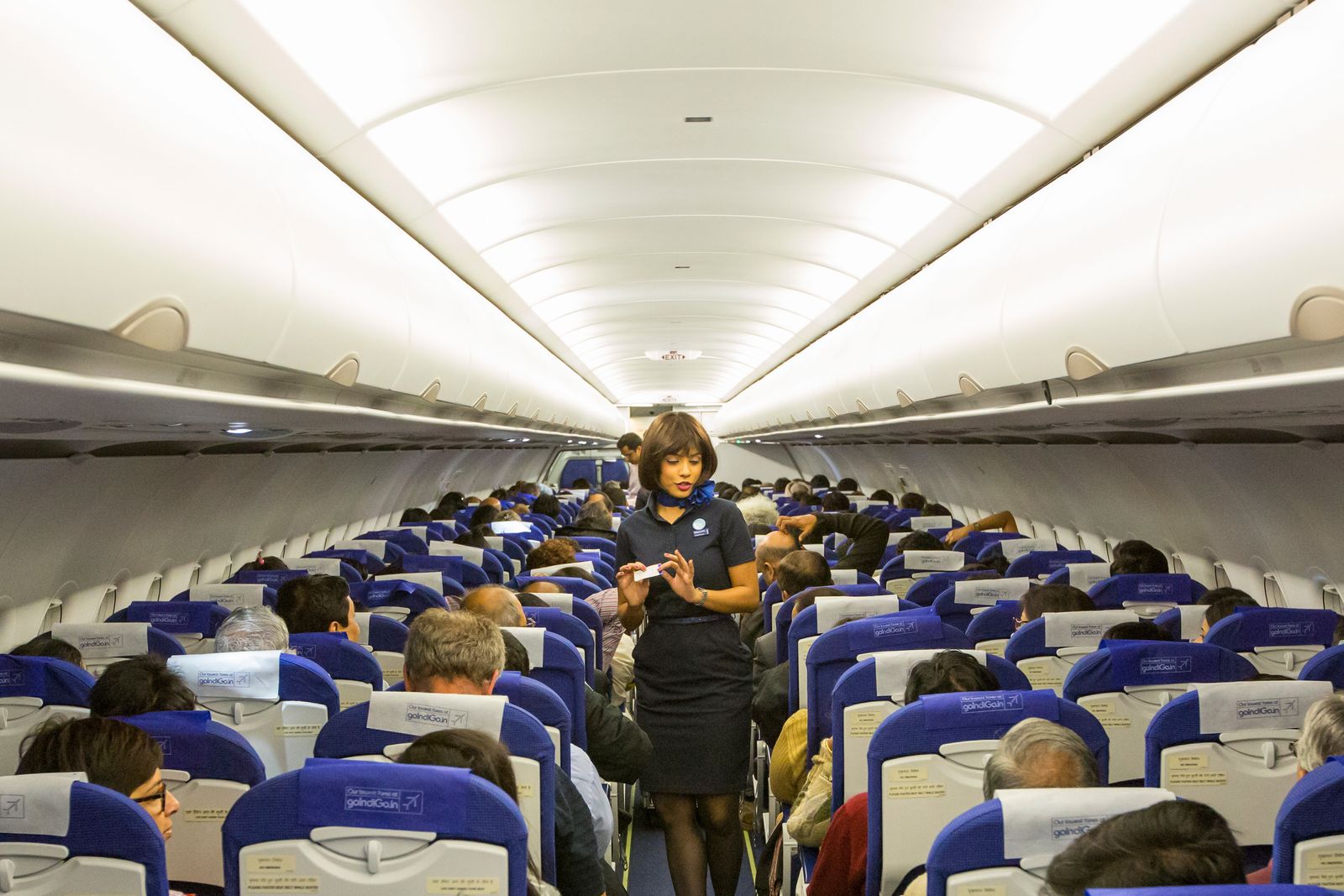 Why Do Flight Attendants Sit on Their Hands?