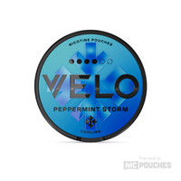 VELO Peppermint Storm nicotine pouches tin with bold blue design for intense minty freshness, plant-based fibres, tobacco-free.