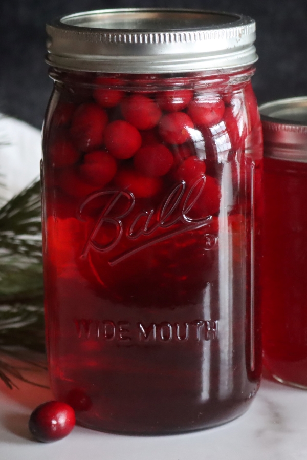 Canning cranberry juice by adding fresh cranberries to a jar without juicing