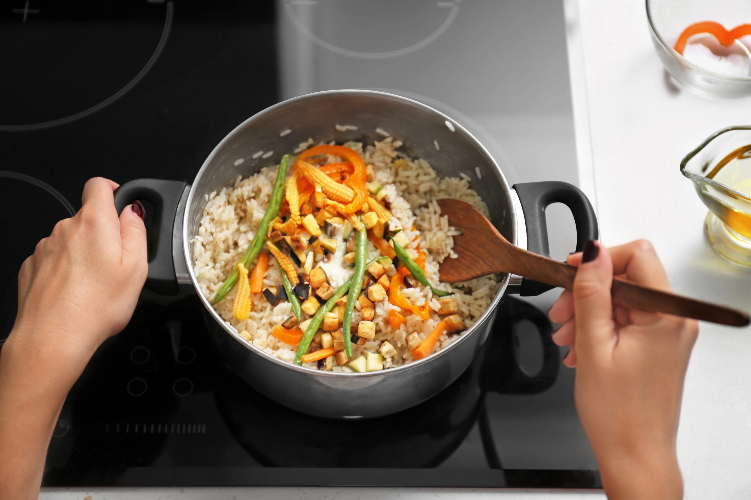 image: large pot of rice and vegetables on stovetop