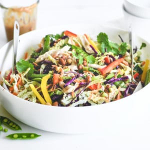 Thai chicken salad with jar of dressing