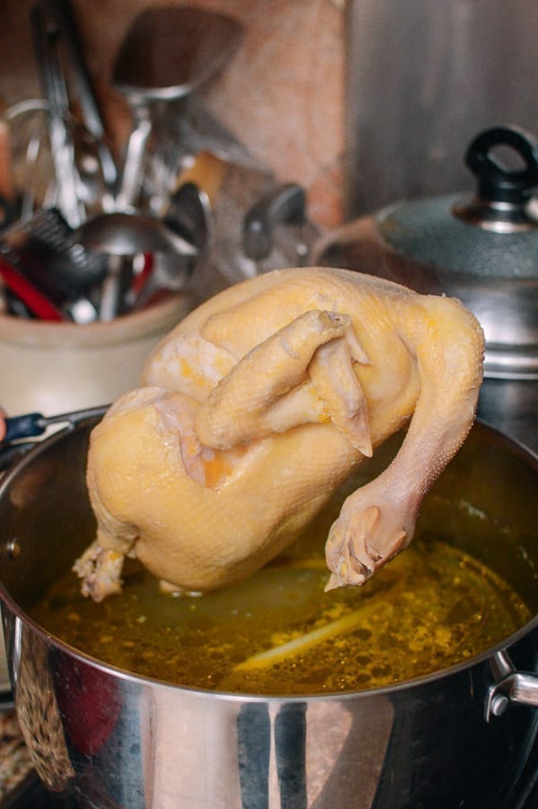 Lifting chicken out of pot, thewoksoflife.com