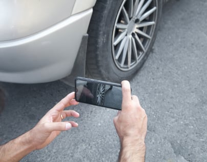 Competitive advertising rates A customer viewing their advertised vehicles on a smartphone via Autotrader