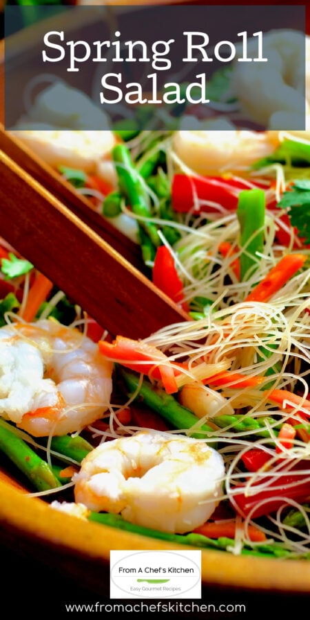 Pinterest graphic for Vietnamese Spring Roll Salad showing it in a wooden bowl with wooden tongs tossing the noodles.