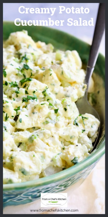 Creamy Potato Cucumber Salad in green bowl with serving spoon.