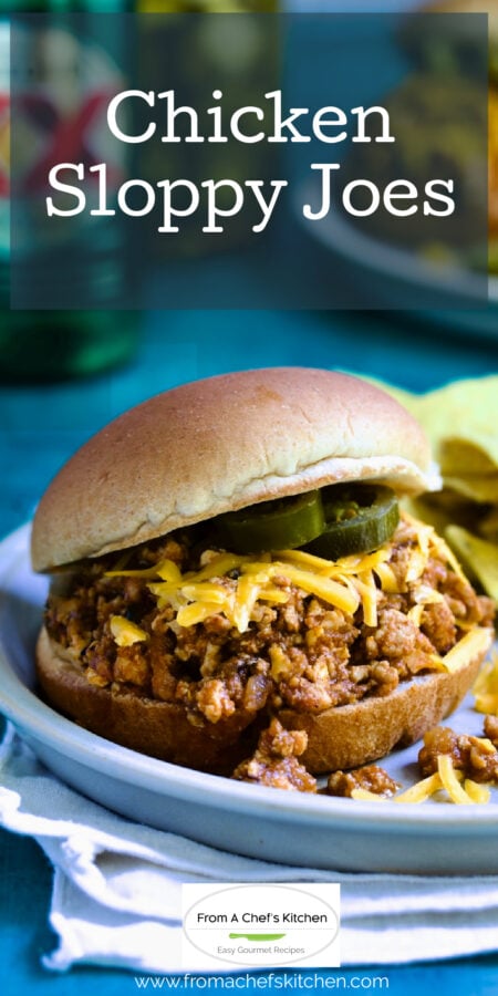 Pinterest graphic for Chicken Sloppy Joes showing one on a small plate with tortilla chips.