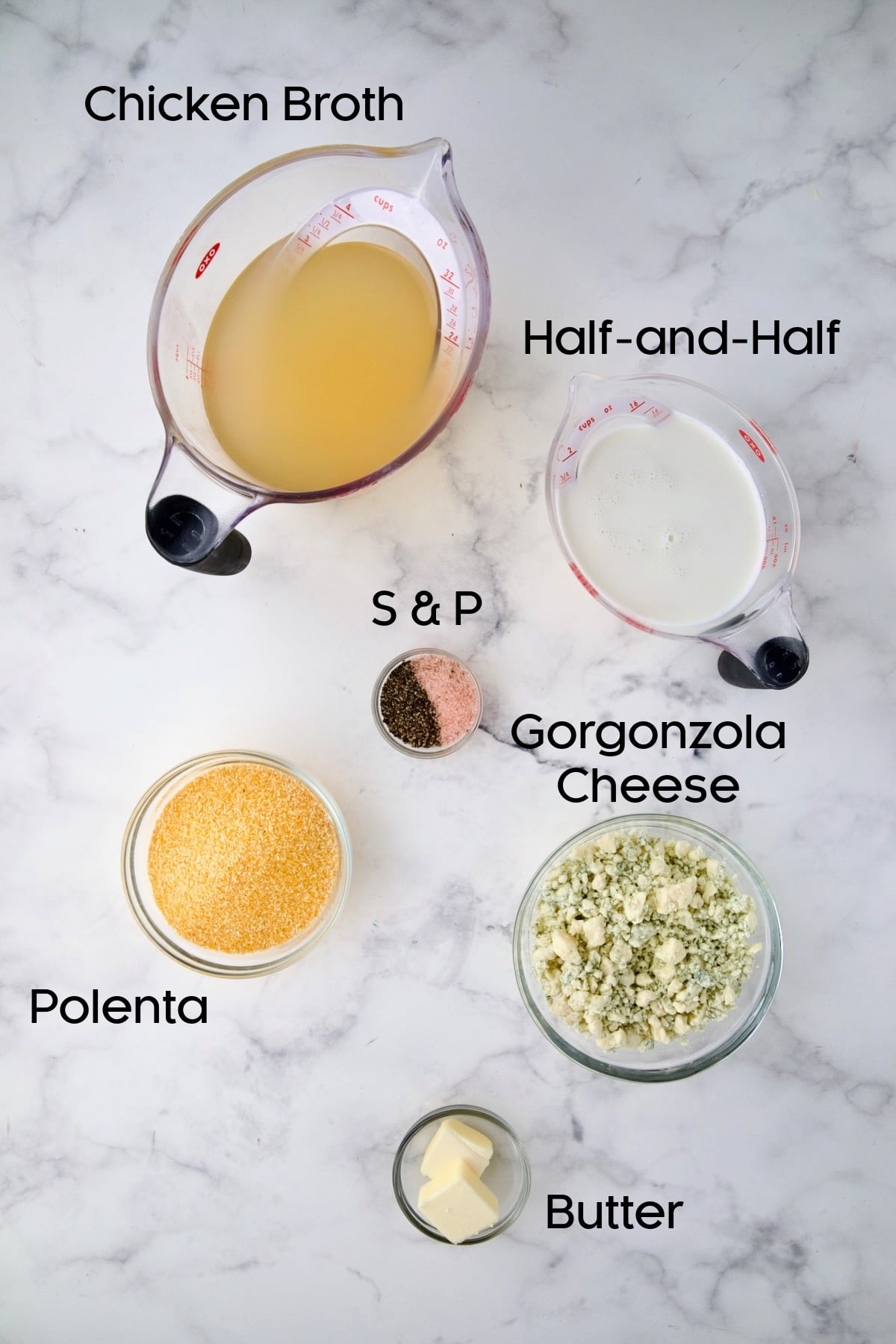 Ingredients for Gorgonzola polenta in glass bowls.