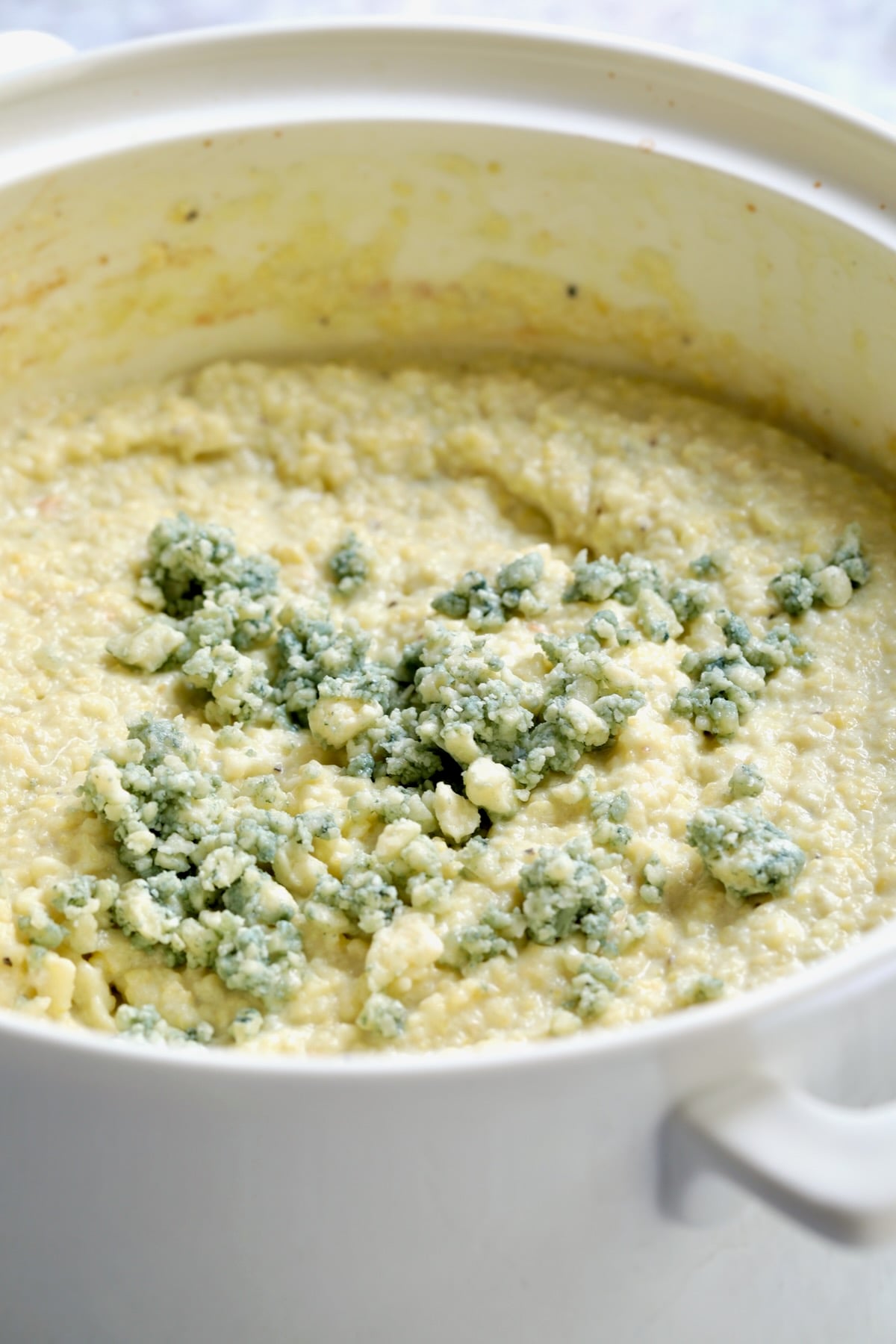 Gorgonzola Polenta in white ceramic baking dish.