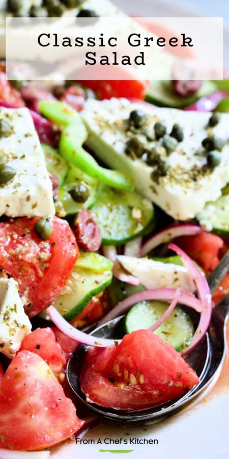 Pinterest graphic for Classic Greek Salad showing it on an oval white platter.
