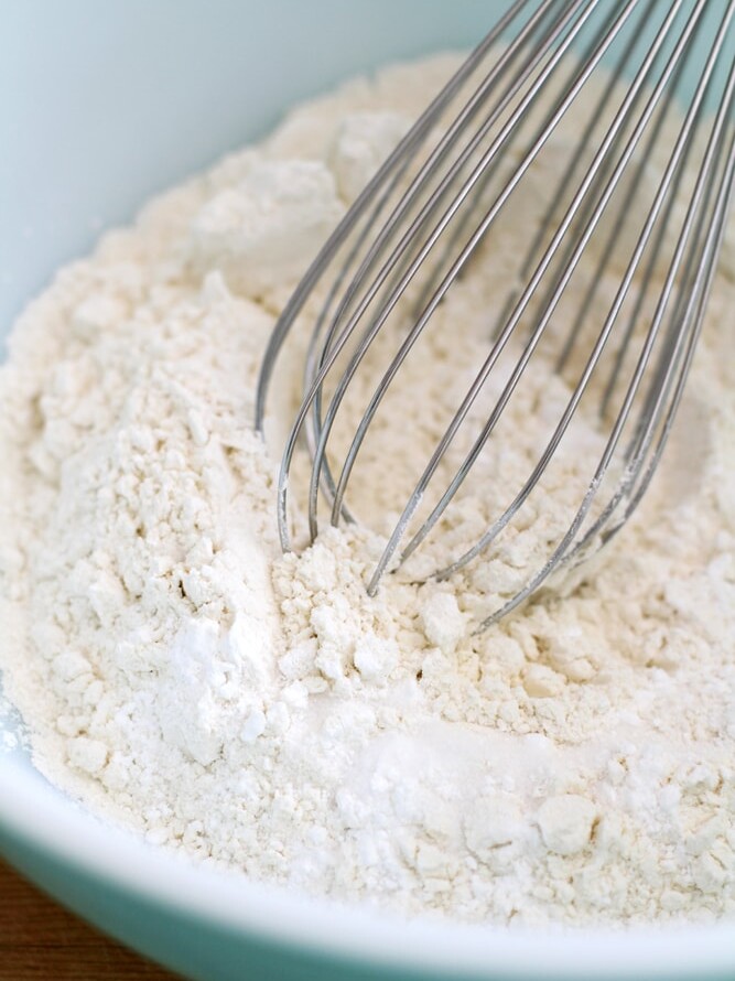 mixing flour in bowl.