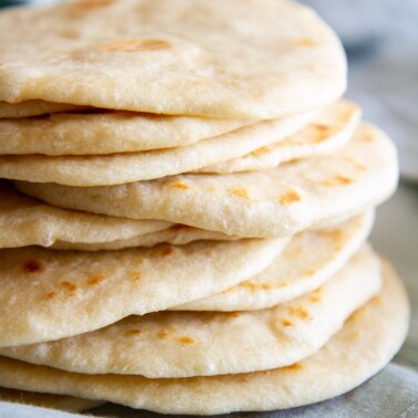 stack of homemade soft flour tortillas.