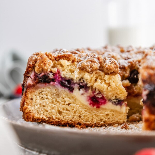 a close-up shot of a slice of berry cream cheese coffee cake.