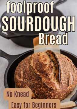 baked sourdough bread loaf in combo baker with scoring and text overlay.