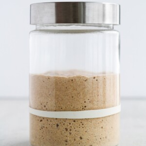sourdough starter doubled in glass jar.