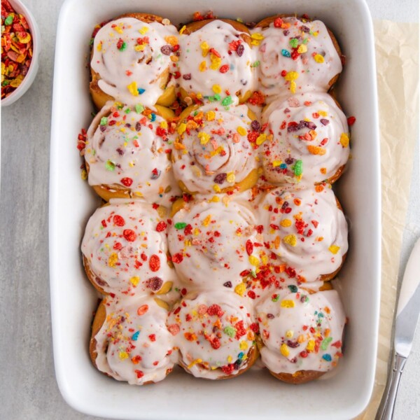 cereal milk cinnamon rolls in baking dish.