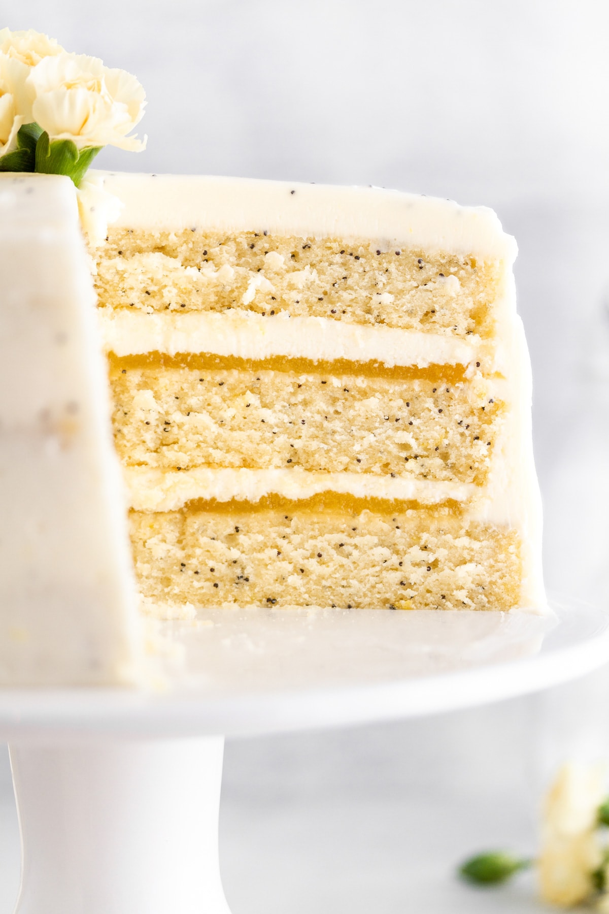 a close up shot of lemon poppy seed cake.