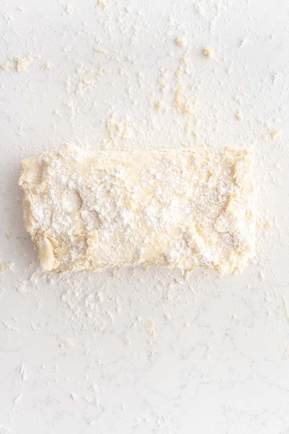 rough puff pastry dough on a surface.