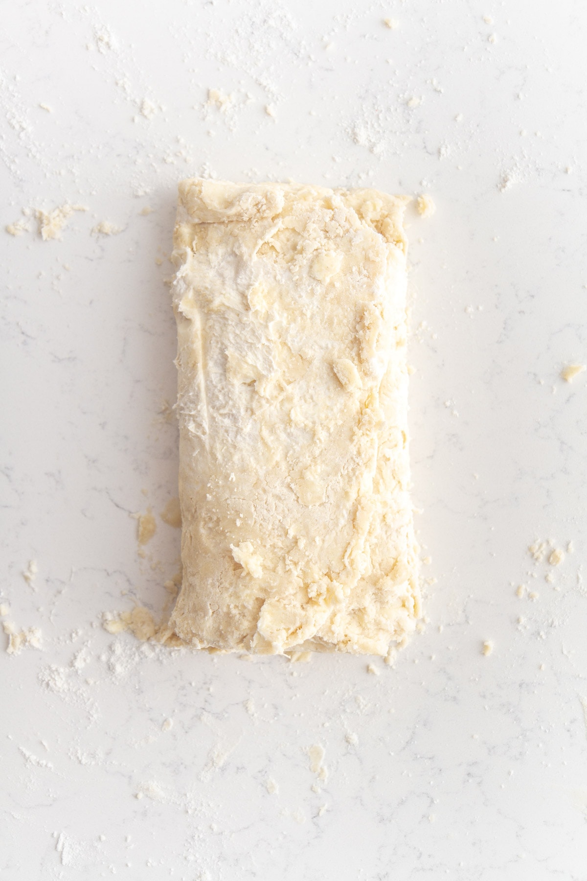 rough puff pastry dough folded like a business letter.