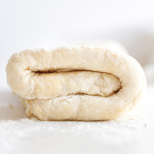 rough puff pastry dough on a surface.