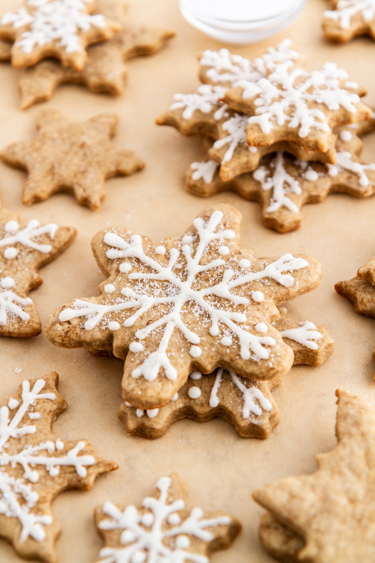 eggnog latte cutout cookies stacked on parchment paper