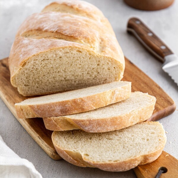 sliced Italian bread on a cutting board.