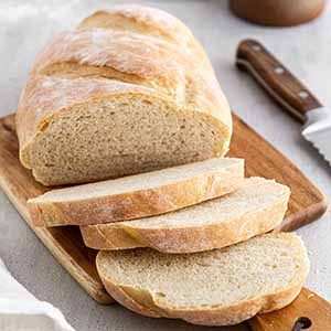 sliced Italian bread on a cutting board.