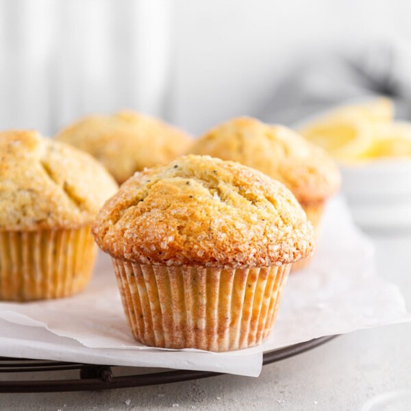 lemon poppy seed muffins on a cooling rack.