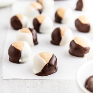 double chocolate buckeyes on parchment paper.