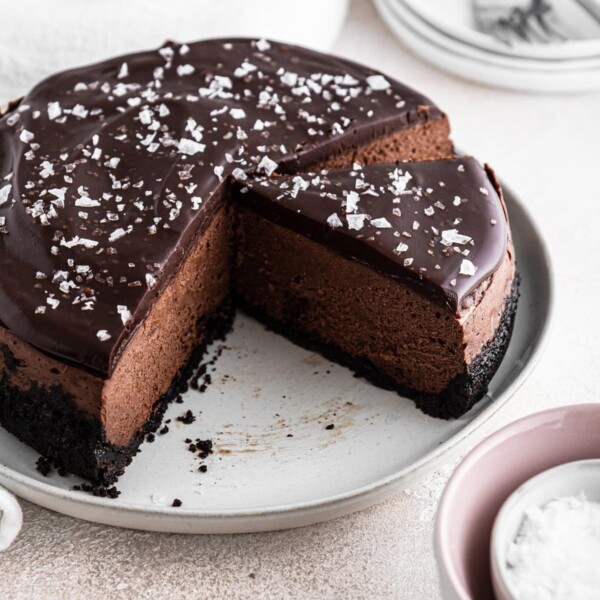sliced chocolate cheesecake on white plate.