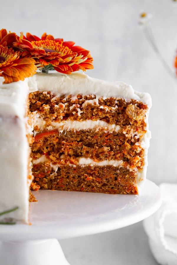 close-up of a slice of carrot cake on a cake stand