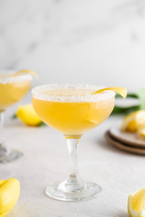 bee's knees cocktail in a coupe glass