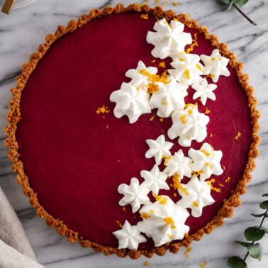 overhead shot of cranberry gingersnap tart on a surface.