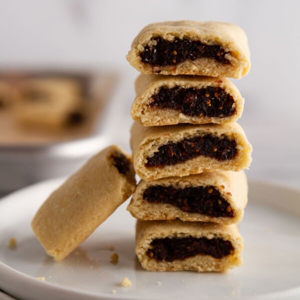 stacked homemade fig newtons on a plate.