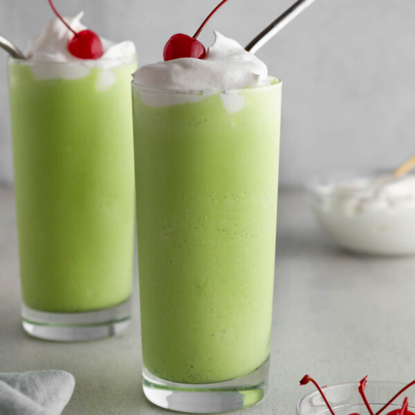 shamrock shake milkshakes on a surface.
