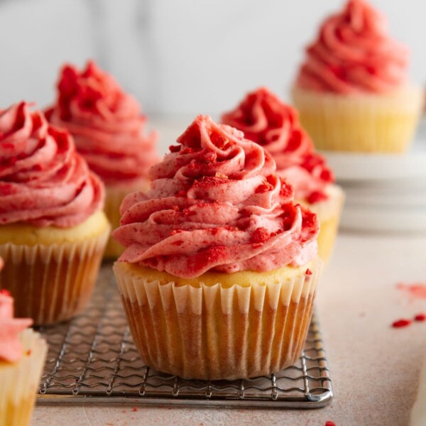 strawberry shortcake cupcakes on a cooling rack.