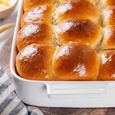 baked rolls glistening with butter.