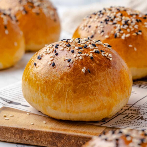 brioche bun with seeds on top.