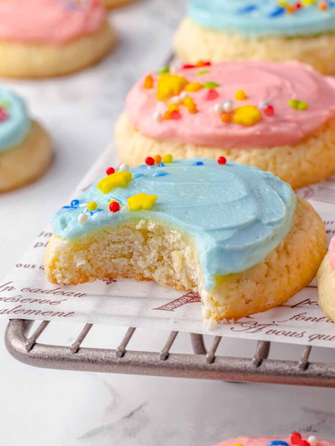 blue frosted sugar cookie bitten.