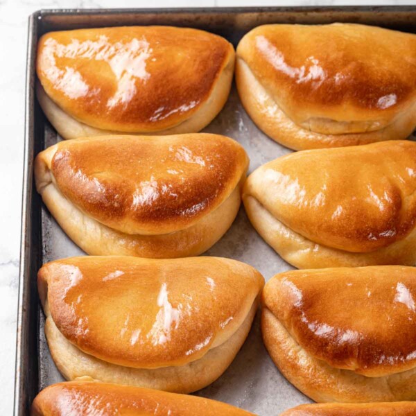 traditional folded pocketbook shape of parker house rolls golden brown.