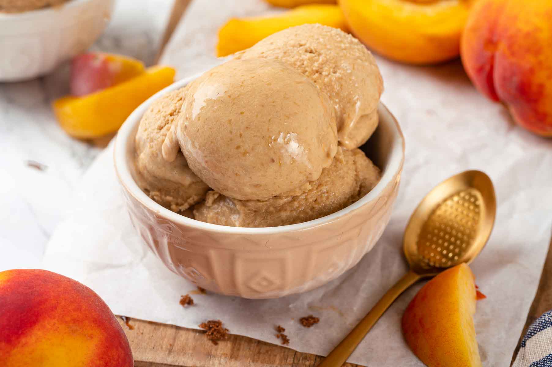 Peach ice cream with fresh peaches.